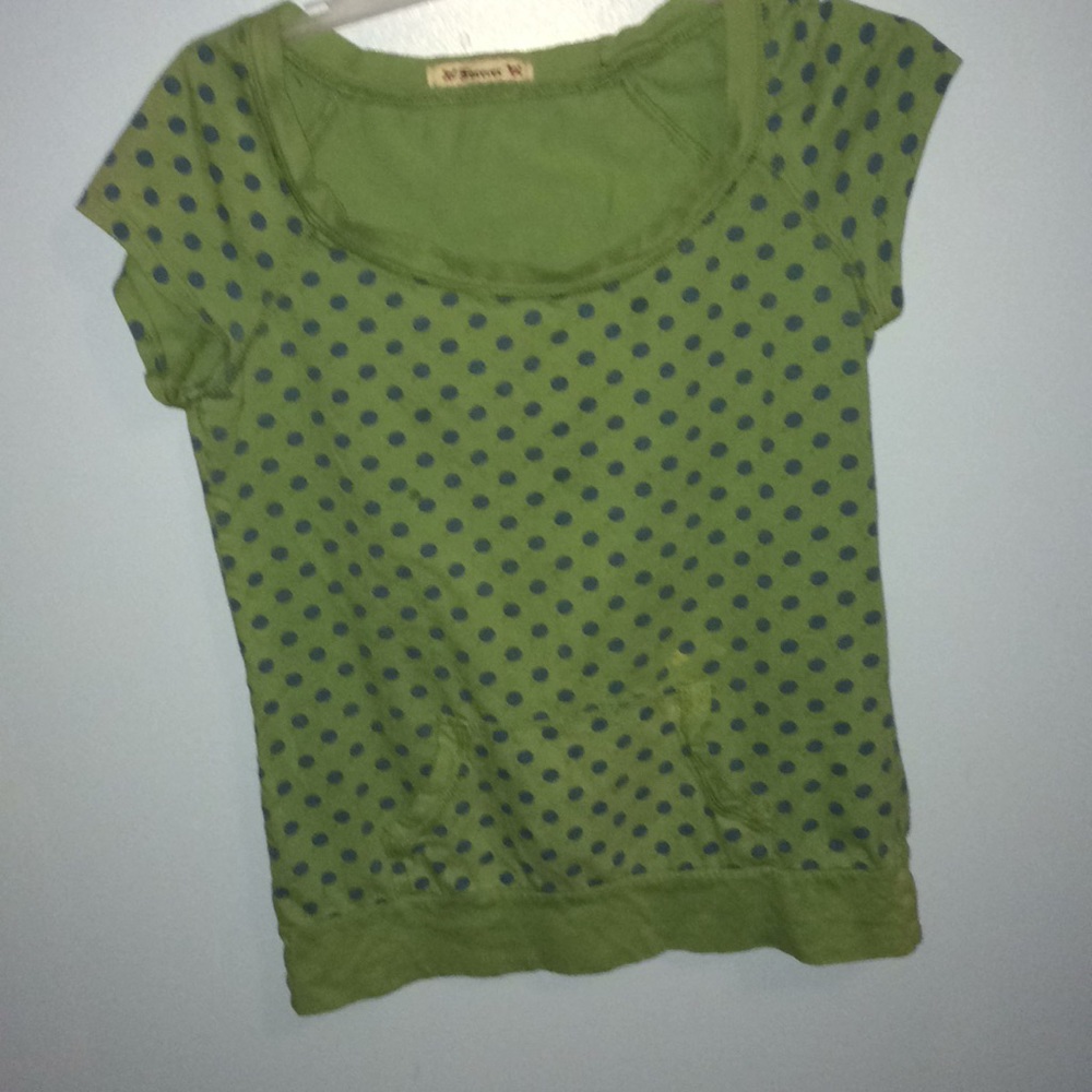 Polkadot front pocket shirt.